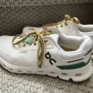On cloud- Cloudrunner 2 Running White Sneakers with Green and Gold Accents